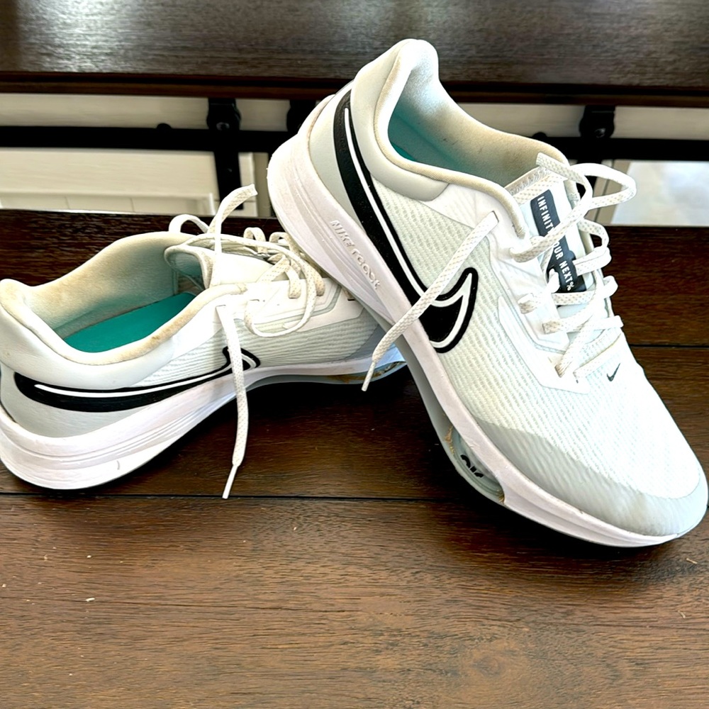 Size 13 Nike golf shoes.